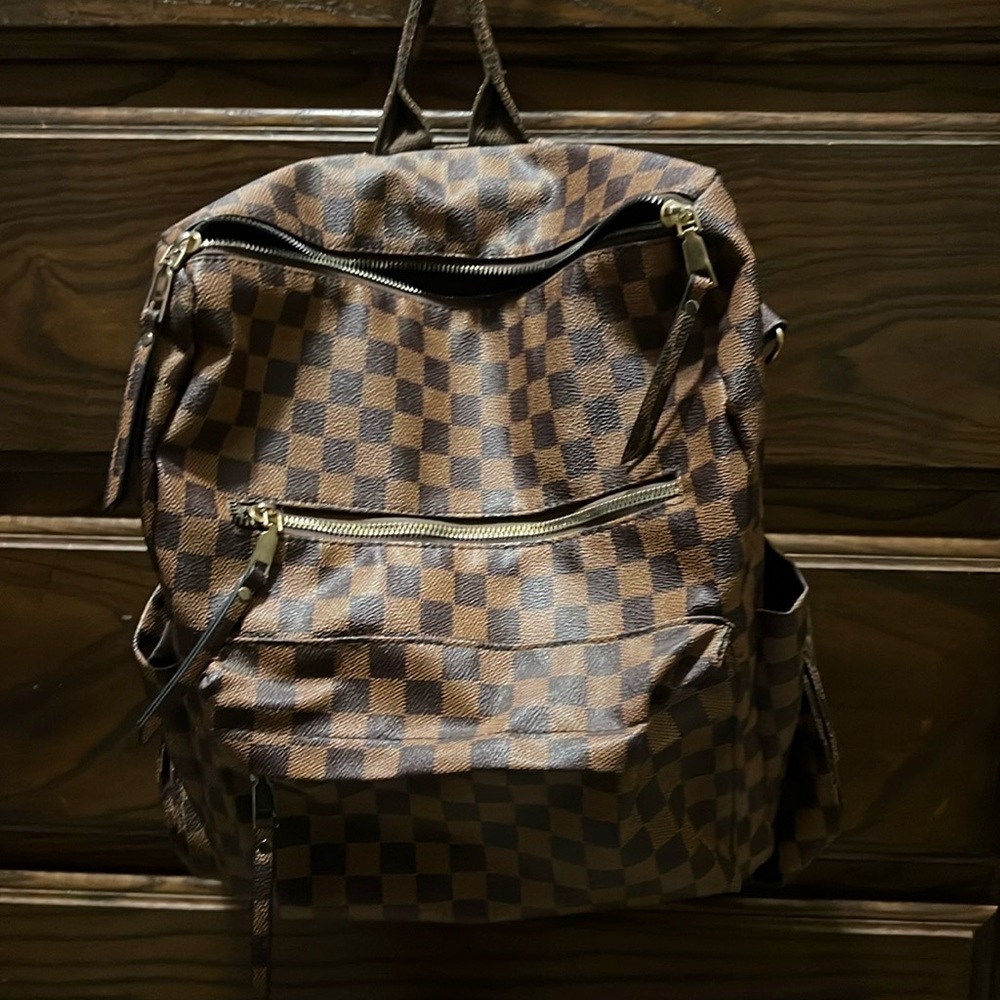 Brown checkered backpack with straps